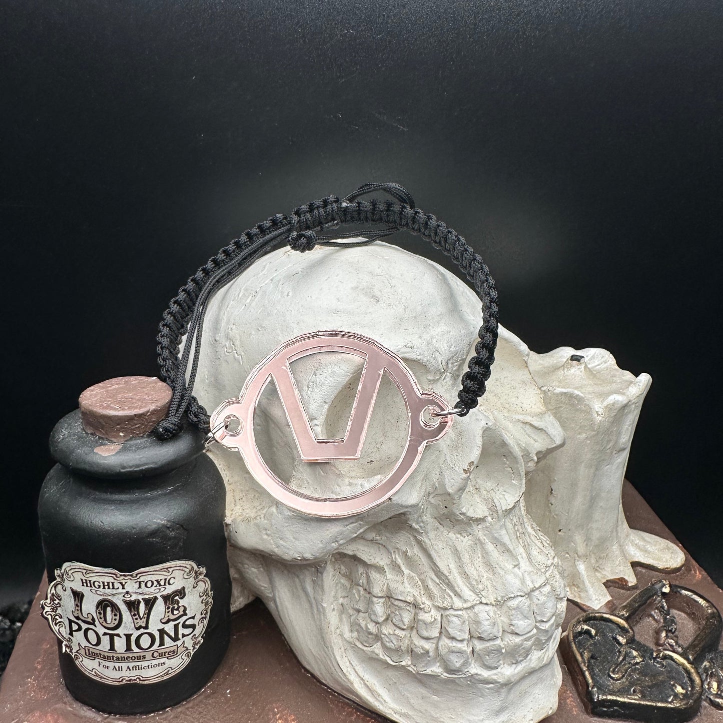 Swinger Symbol Blush Acrylic Bracelet on Adjustable Black Cord