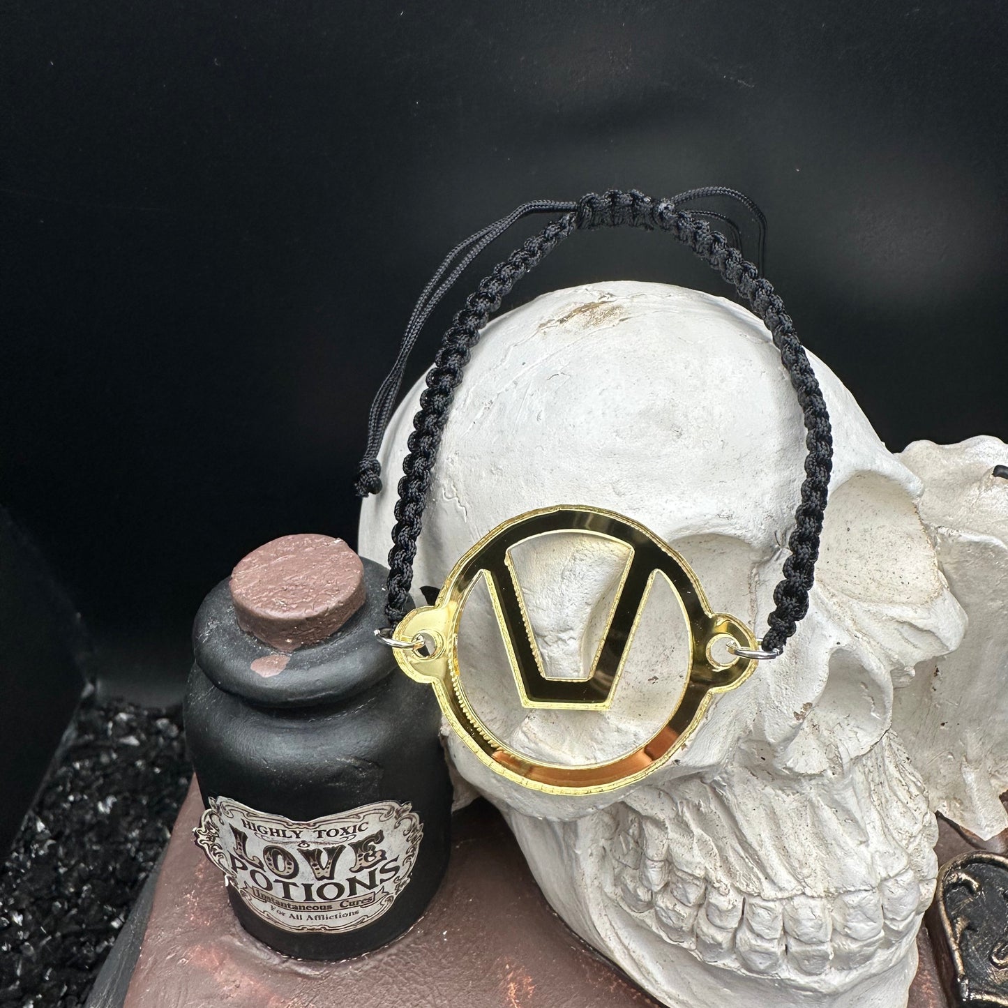 Swinger Symbol Gold Acrylic Bracelet on Adjustable Black Cord