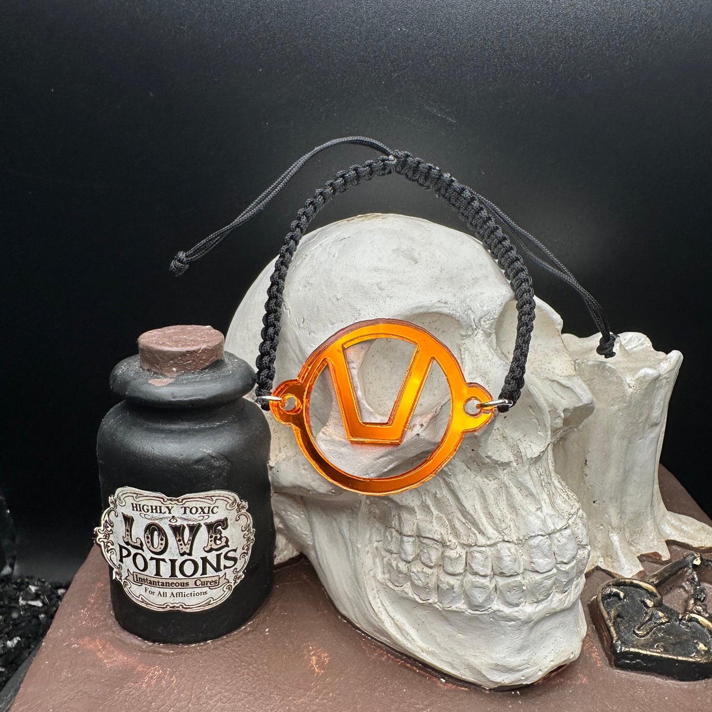 Swinger Symbol Orange Acrylic Bracelet on Adjustable Black Cord