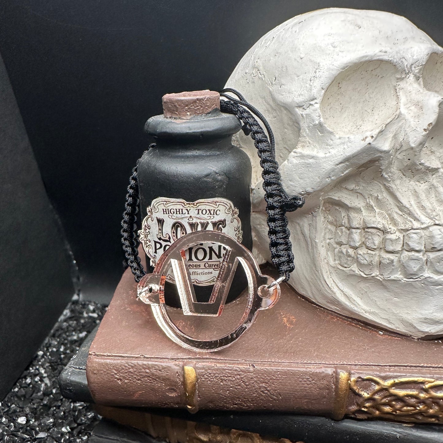 Swinger Symbol Rose Gold Acrylic Bracelet on Adjustable Black Cord