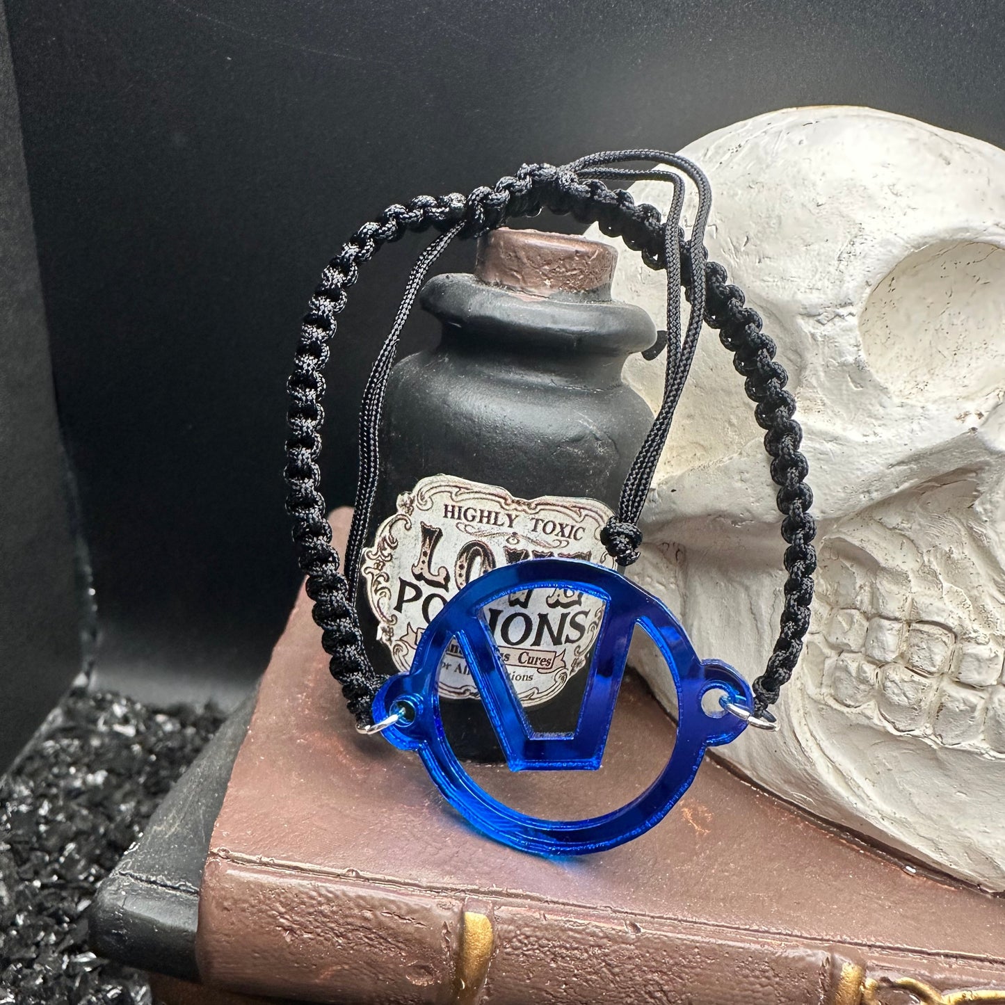 Swinger Symbol Blue Acrylic Bracelet on Adjustable Black Cord