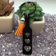 Load image into Gallery viewer, BDSM Heart Paddle Keyring, Black Acrylic w/Orange Tassel
