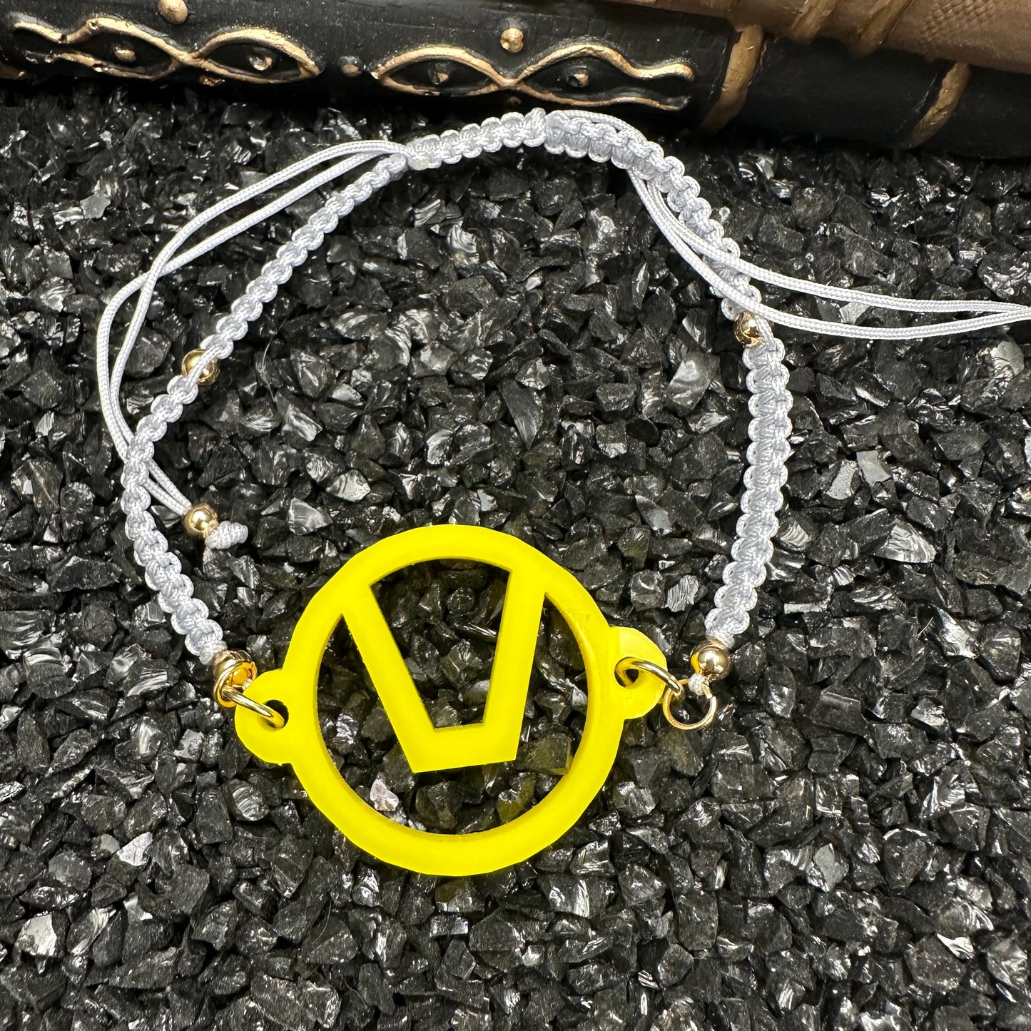 Swinger Symbol Yellow Acrylic Bracelet on Adjustable Grey Cord